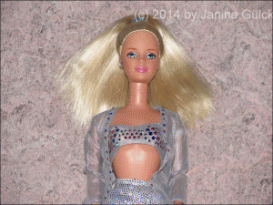 Palmers Millennium Barbie (close up), blonde Barbie doll with hip length hair in a ponytail, pink lips and shining blue eyes 