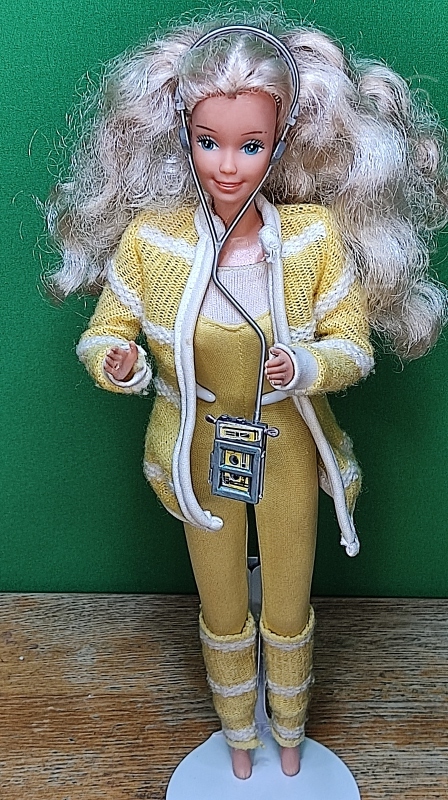 Spanish Music Lovin version Barbie with her walkman and her original outfit and full curly hair. She's a hard to find doll.